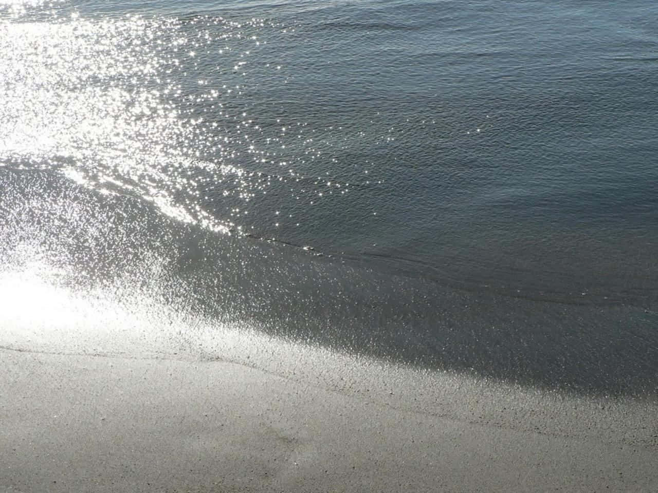 Serene Tropical Beach With Crystal Clear Waters And Pristine Sand Wallpaper