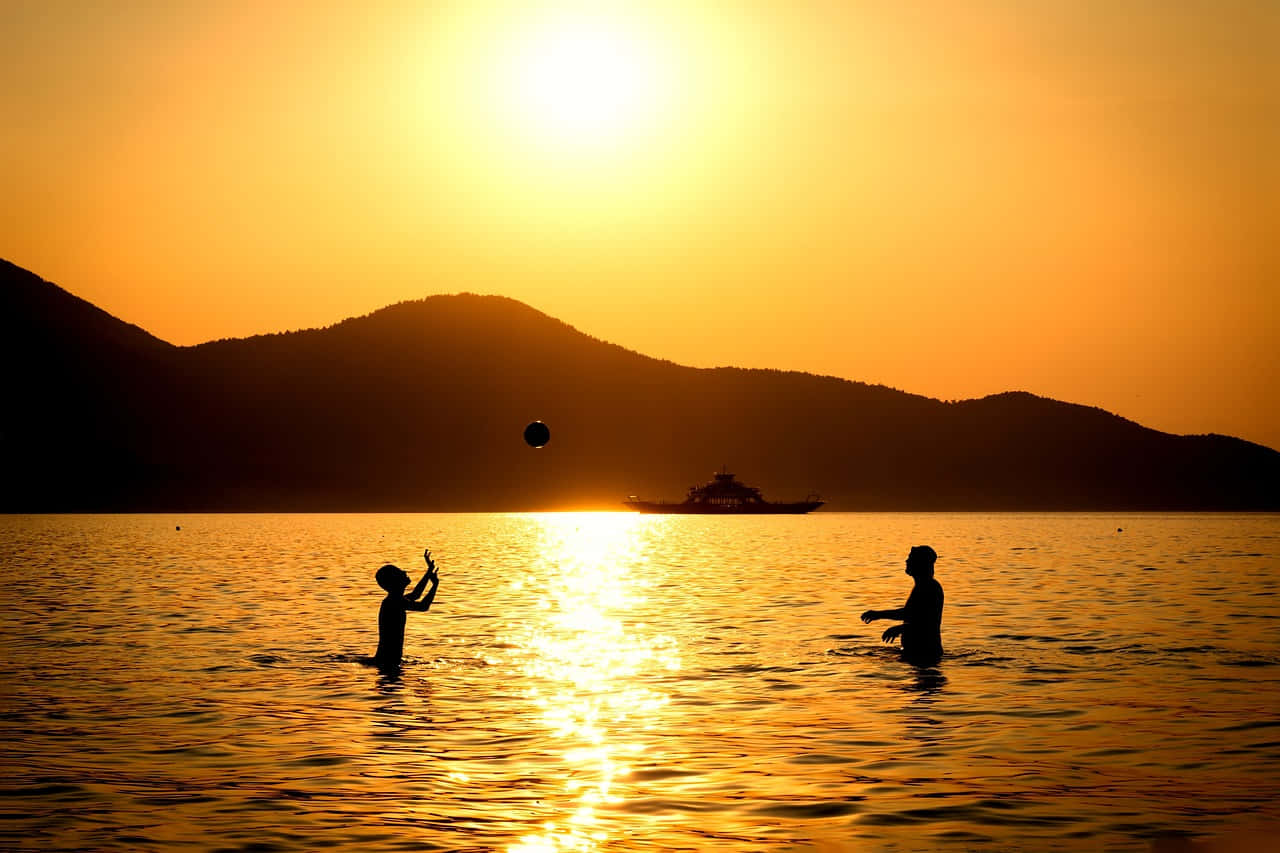 Serene Yellow Beach At Sunset Wallpaper