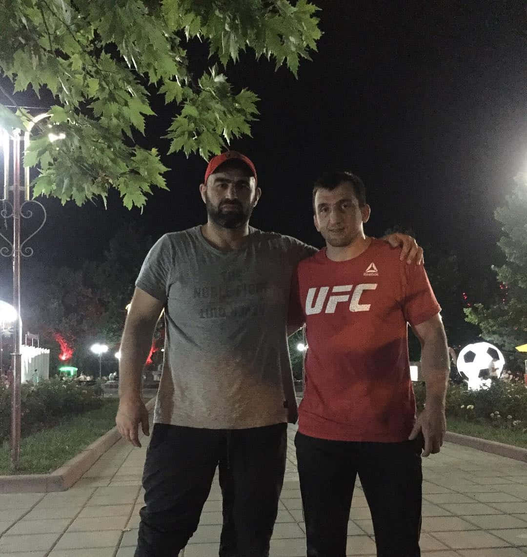 Shamil Abdurakhimov With Man In Ufc Shirt Wallpaper