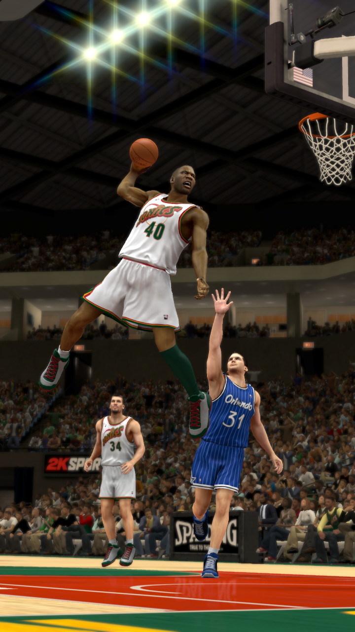 Shawn Kemp Power Dunking During An Nba Game Wallpaper