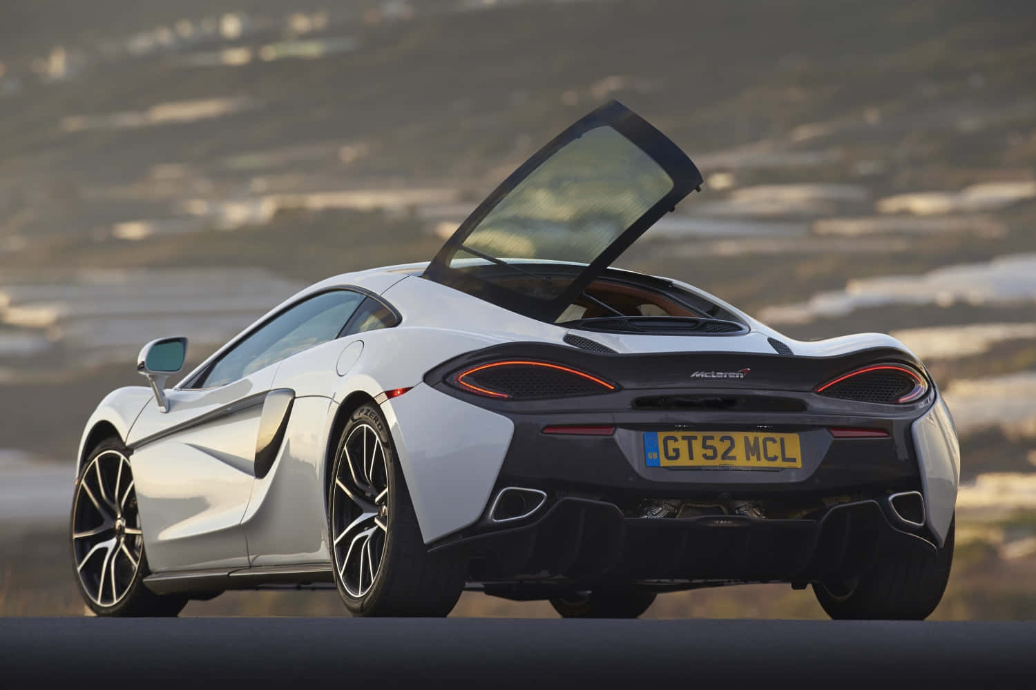 Sheer Sophistication - Mclaren 570gt On The Open Road Wallpaper