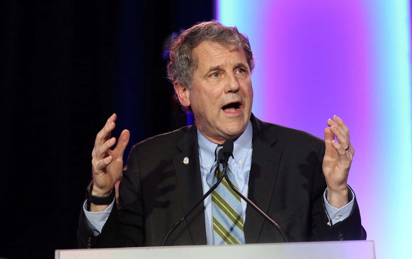 Sherrod Brown Expressively Gesturing During A Speech Wallpaper