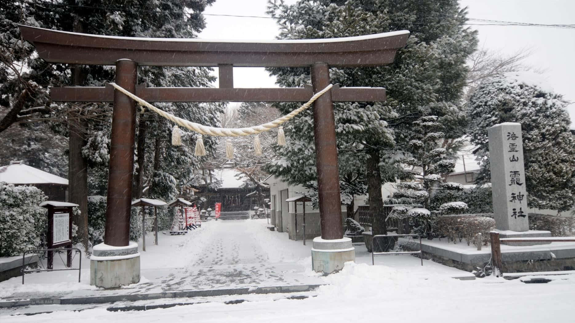 Shinto Shrine Surrounded By A Tranquil Forest Wallpaper