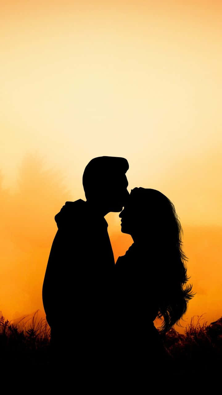 Silhouette Couple Sunset Hug Wallpaper