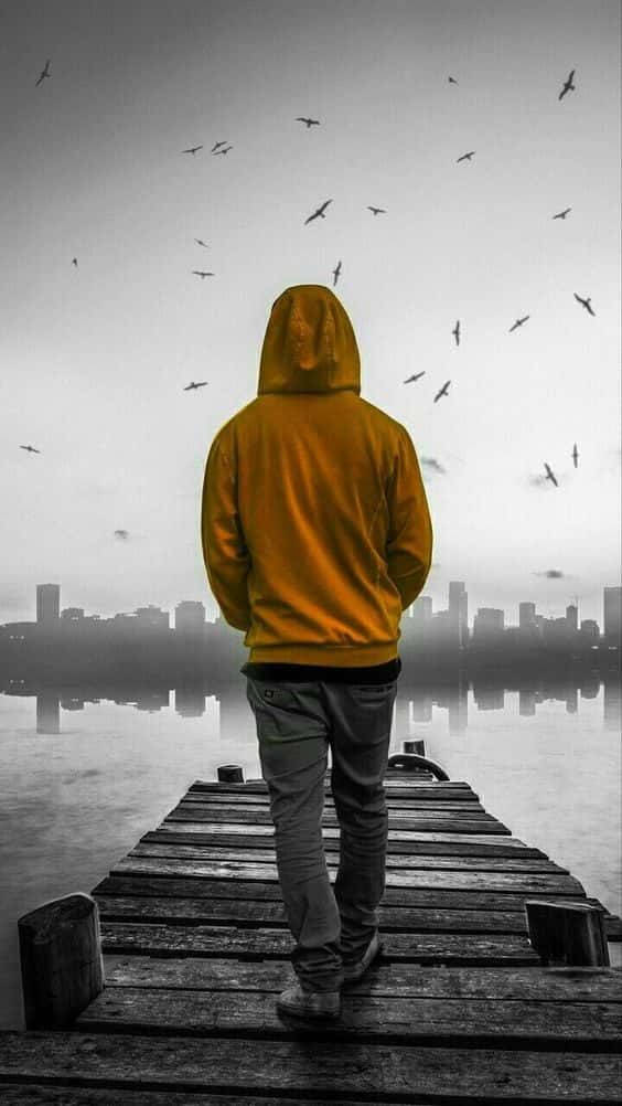 Single Boy In Yellow Hoodie Wallpaper