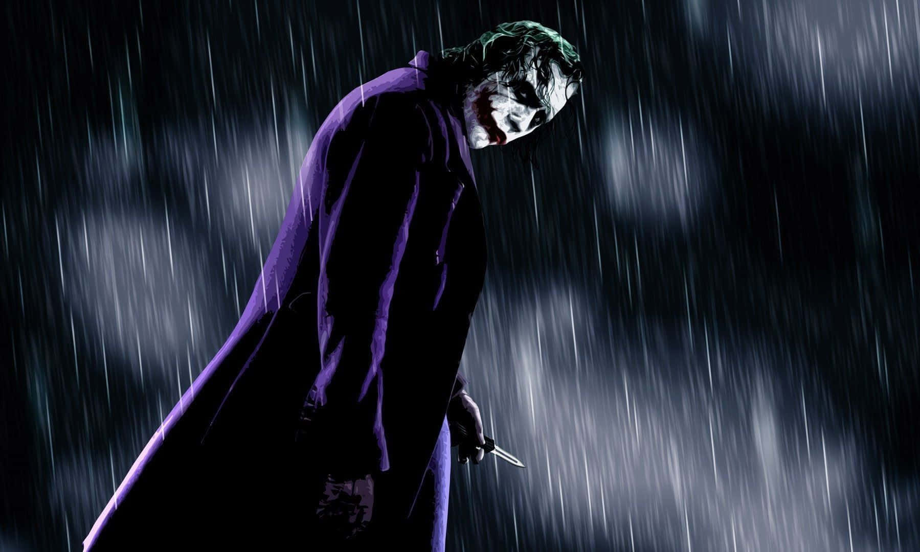 Sinister Evil Joker Grinning In The Shadows Wallpaper