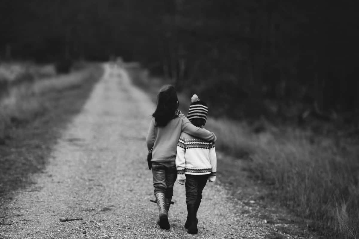 Sisterly_ Bond_on_ Country_ Road Wallpaper