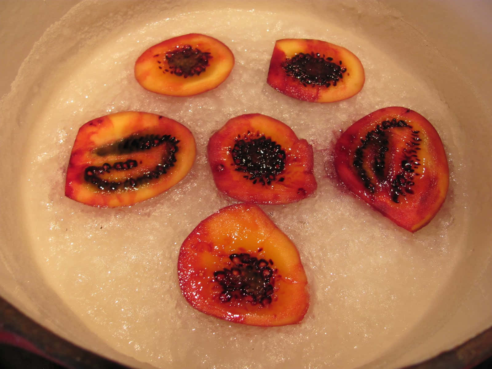 Six Sliced Tamarillo Inside The Bowl With Water Wallpaper