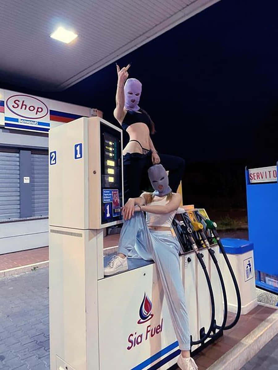 Ski Mask Girl Models Fuel Pump Wallpaper