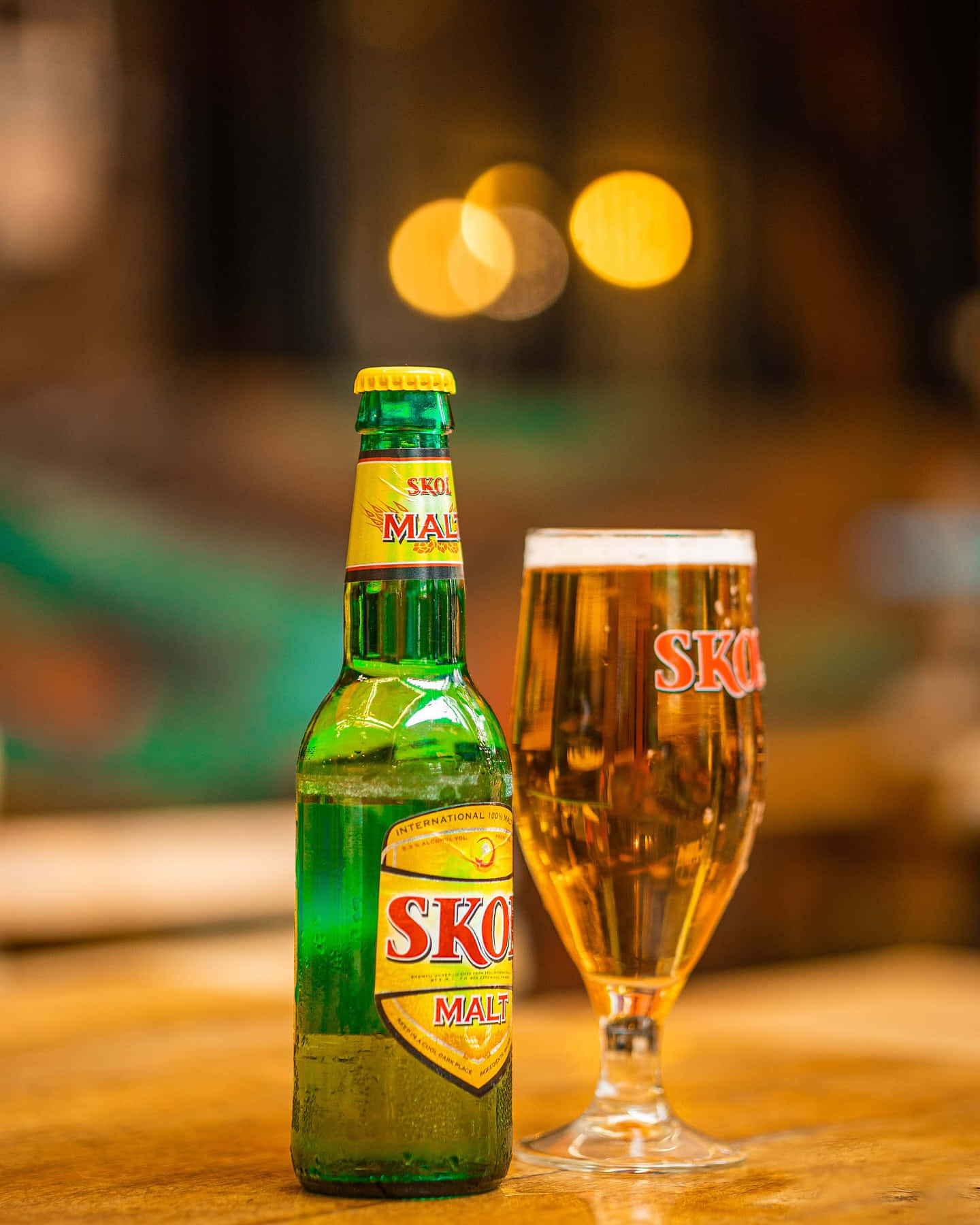 Skol Beer Bottleand Glass Wallpaper