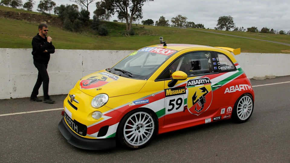 Sleek Abarth 695 In Bold Red Wallpaper