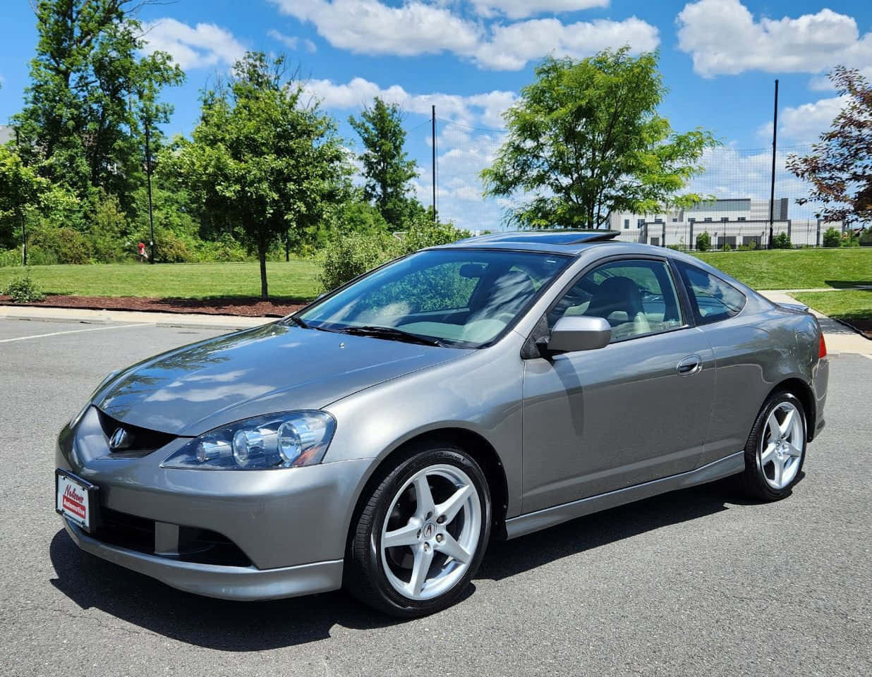 Sleek Acura Rsx Sports Coupe On Scenic Road Wallpaper