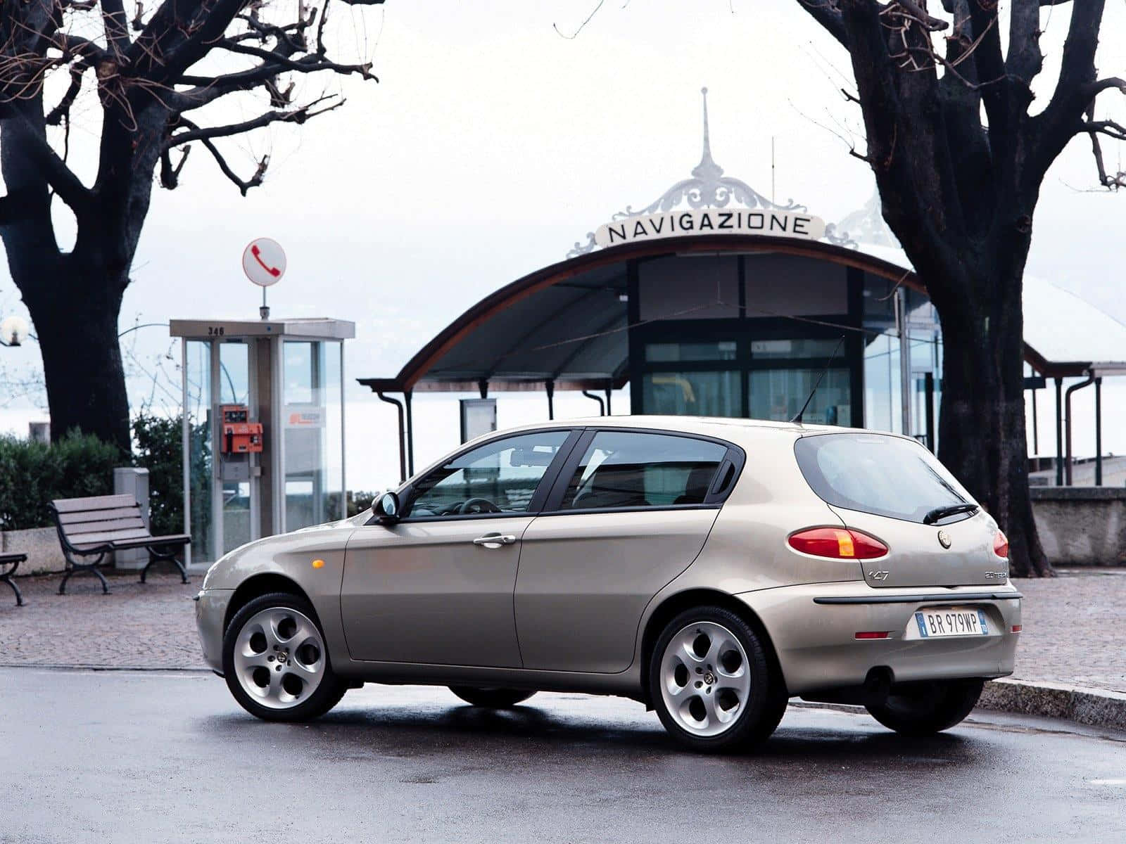 Sleek Alfa Romeo 147 On An Open Road Wallpaper