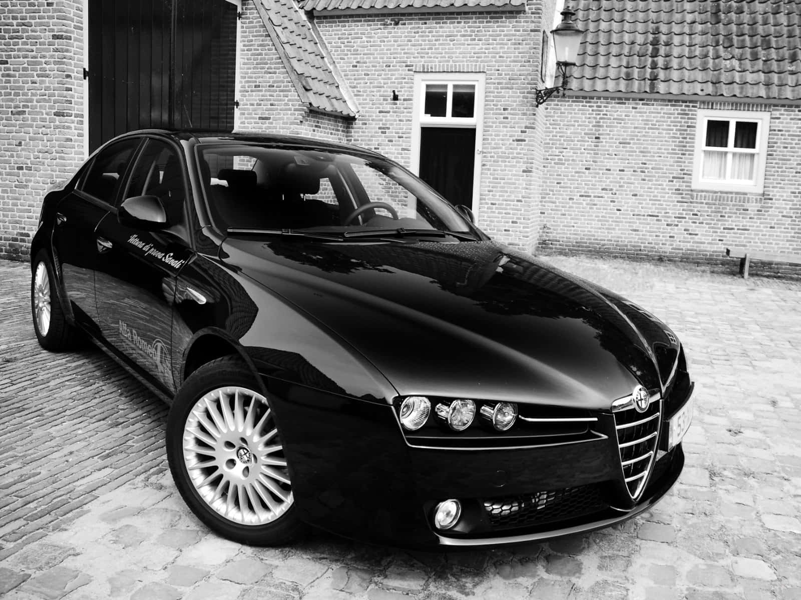 Sleek Alfa Romeo 159 In Full Display Wallpaper