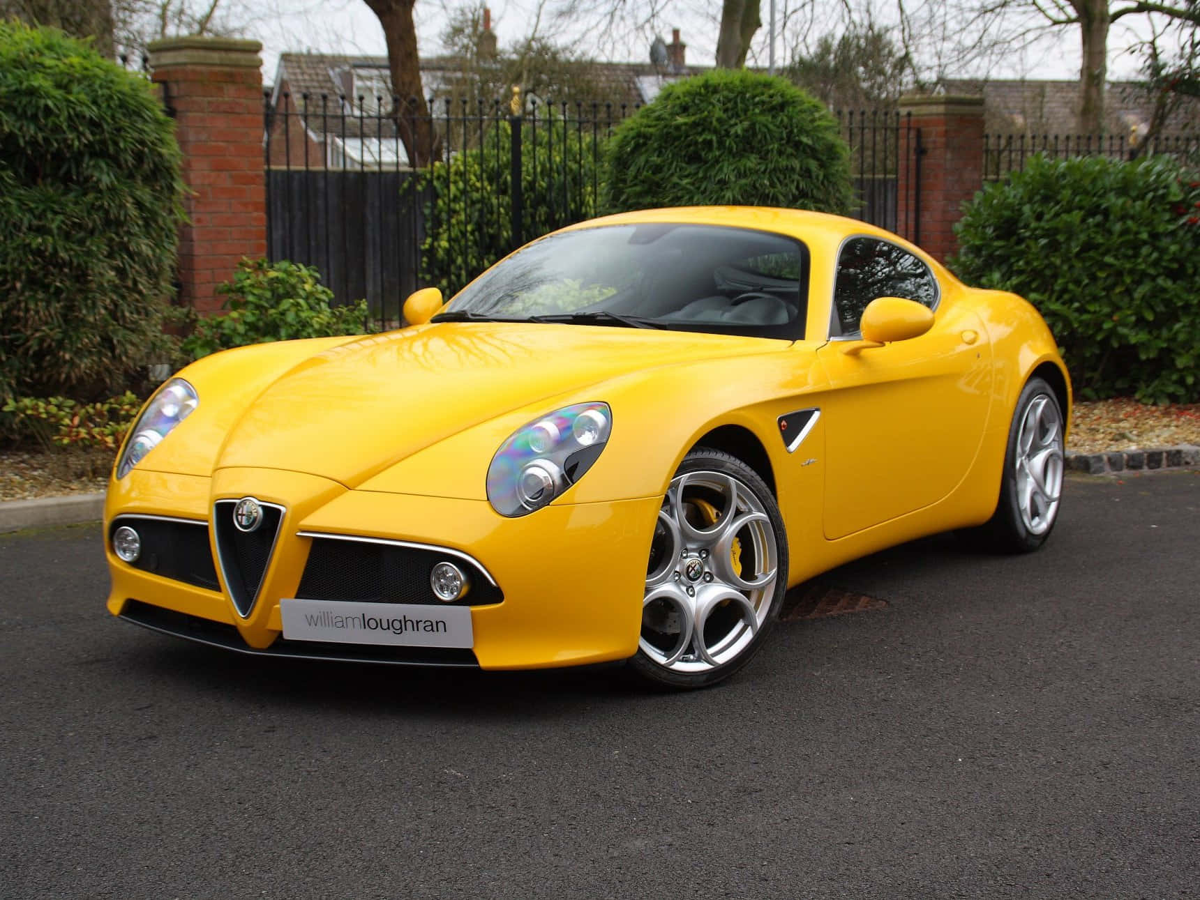 Sleek Alfa Romeo 8c Competizione In Action Wallpaper