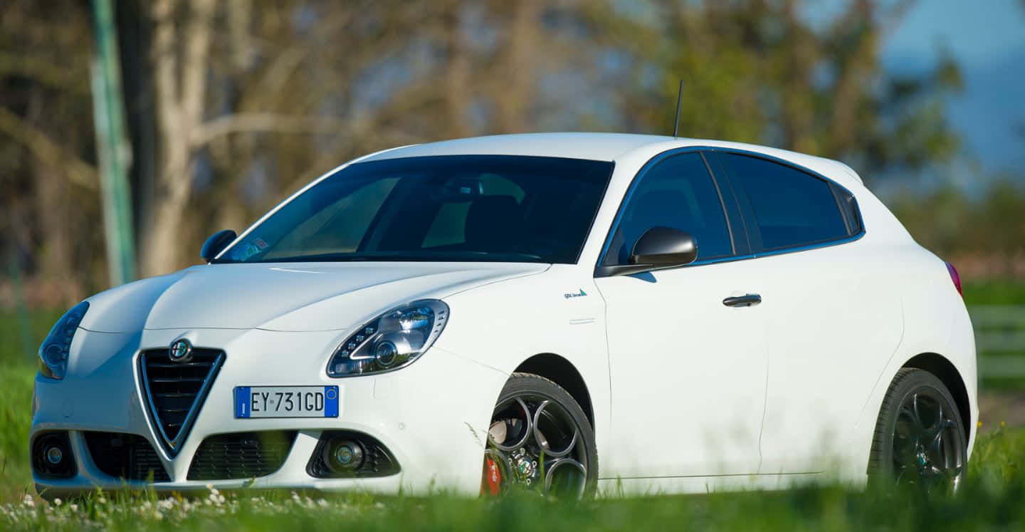 Sleek Alfa Romeo Giulietta In Action Wallpaper