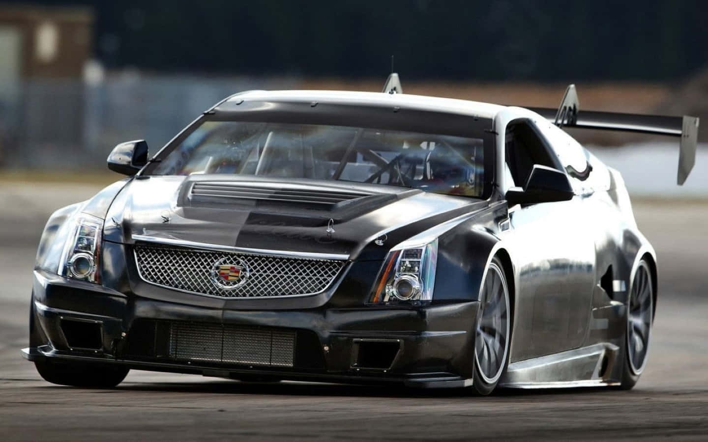 Sleek And Classy Cadillac Cts On The Road Wallpaper