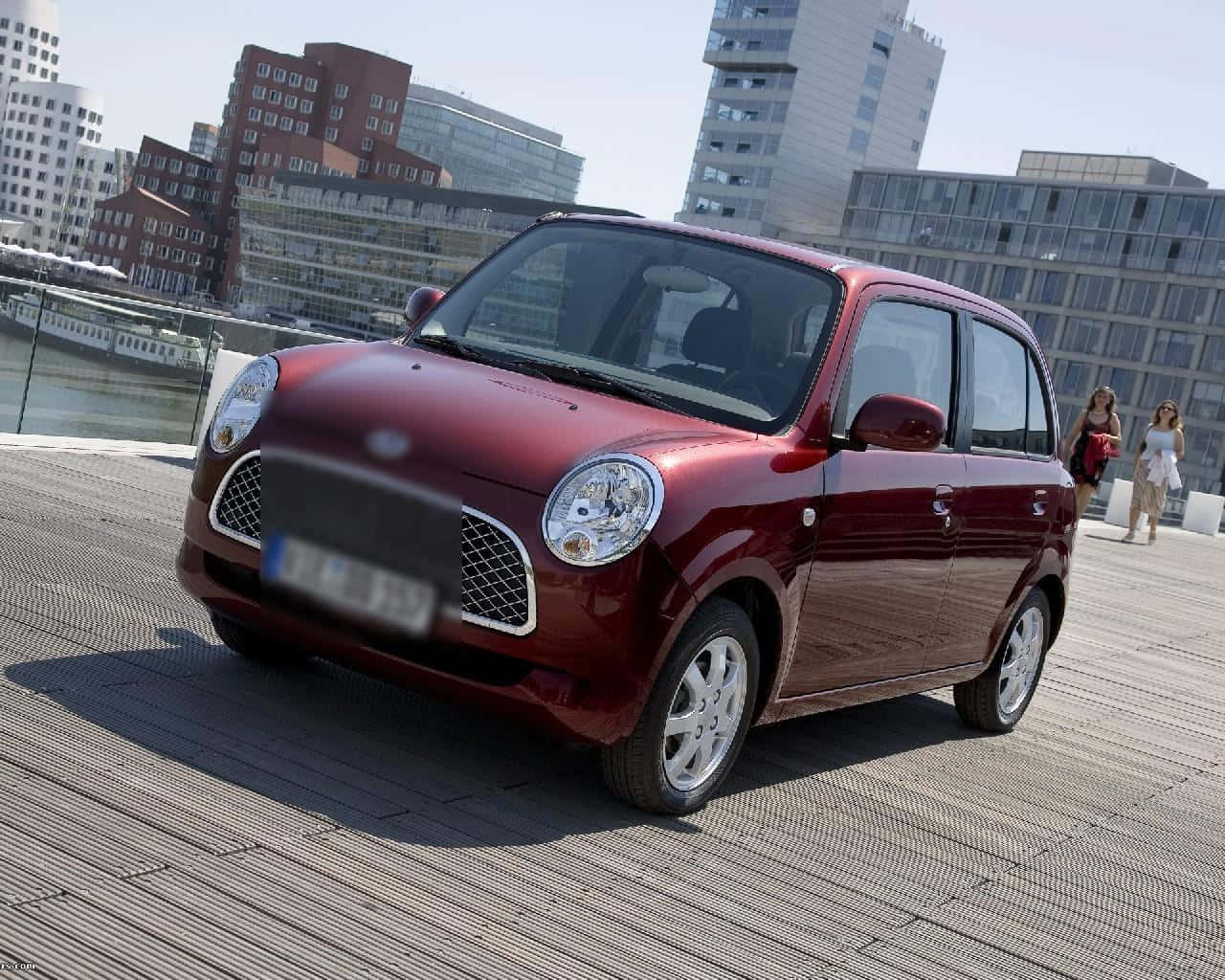 Sleek And Compact Daihatsu Trevis In Vibrant Yellow Wallpaper