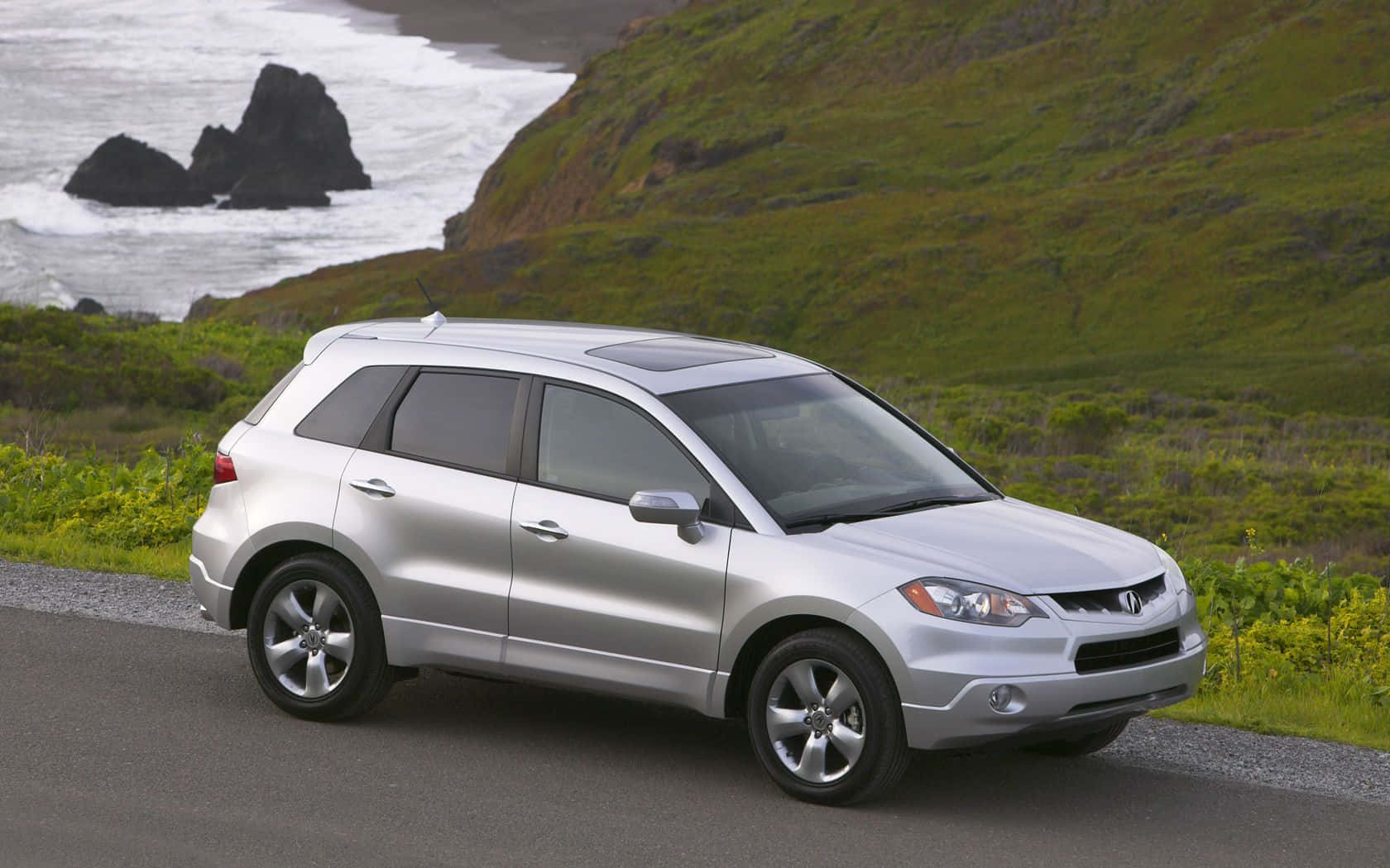 Sleek And Elegant Acura Rdx On The Road Wallpaper