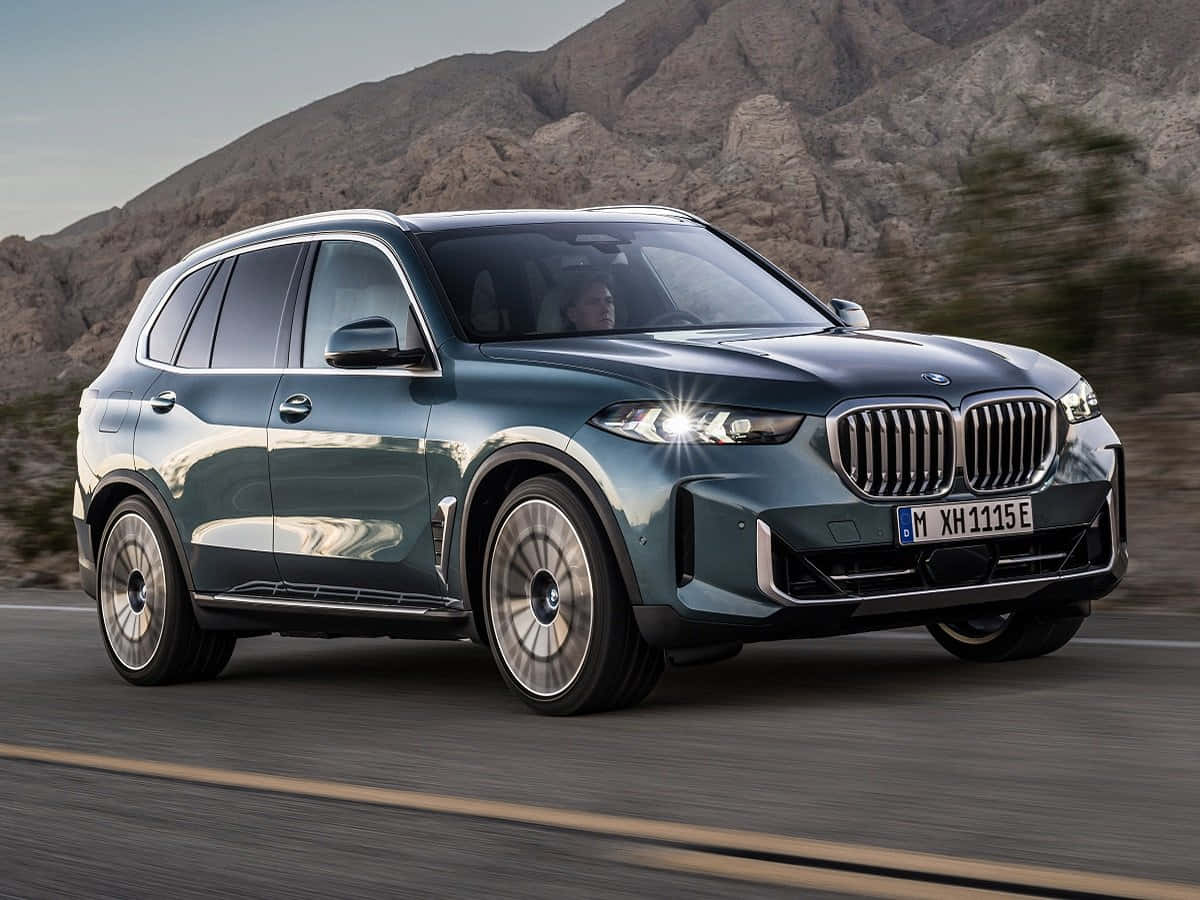 Sleek And Elegant Bmw X5 In Scenic Surroundings Wallpaper