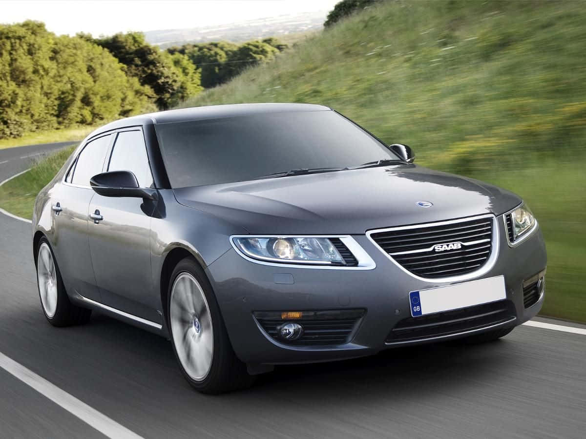 Sleek And Elegant Saab 9-5 In Motion Wallpaper