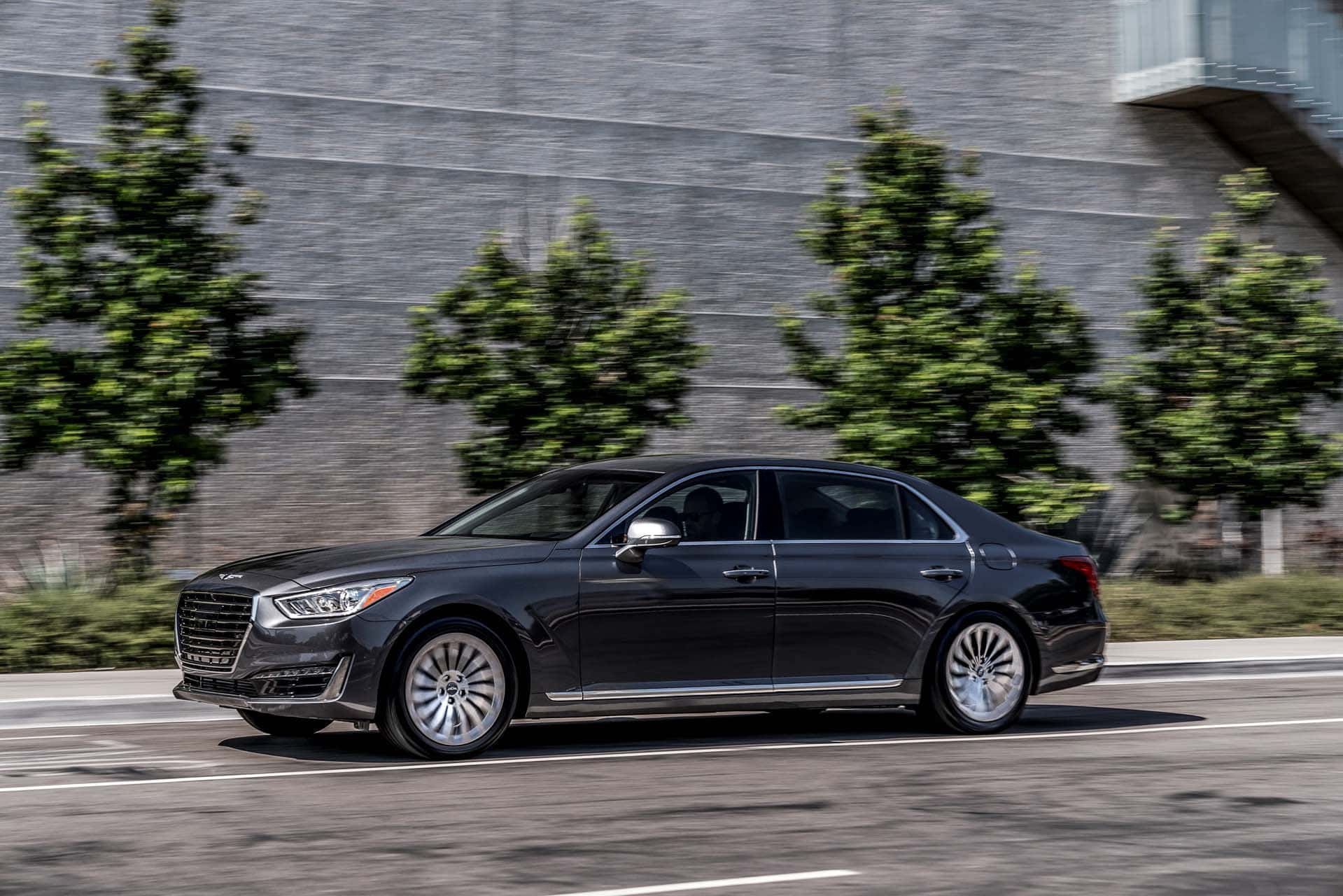 Sleek And Luxurious Genesis G90 In Motion Wallpaper