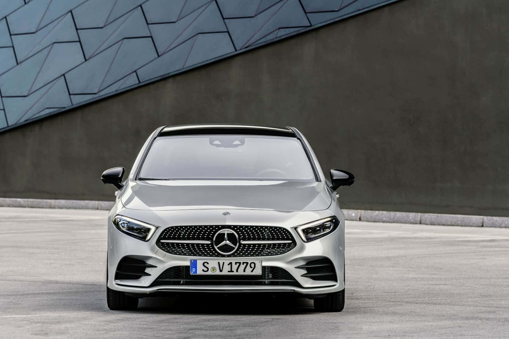 Sleek And Luxurious Mercedes Benz A-class On The Road Wallpaper