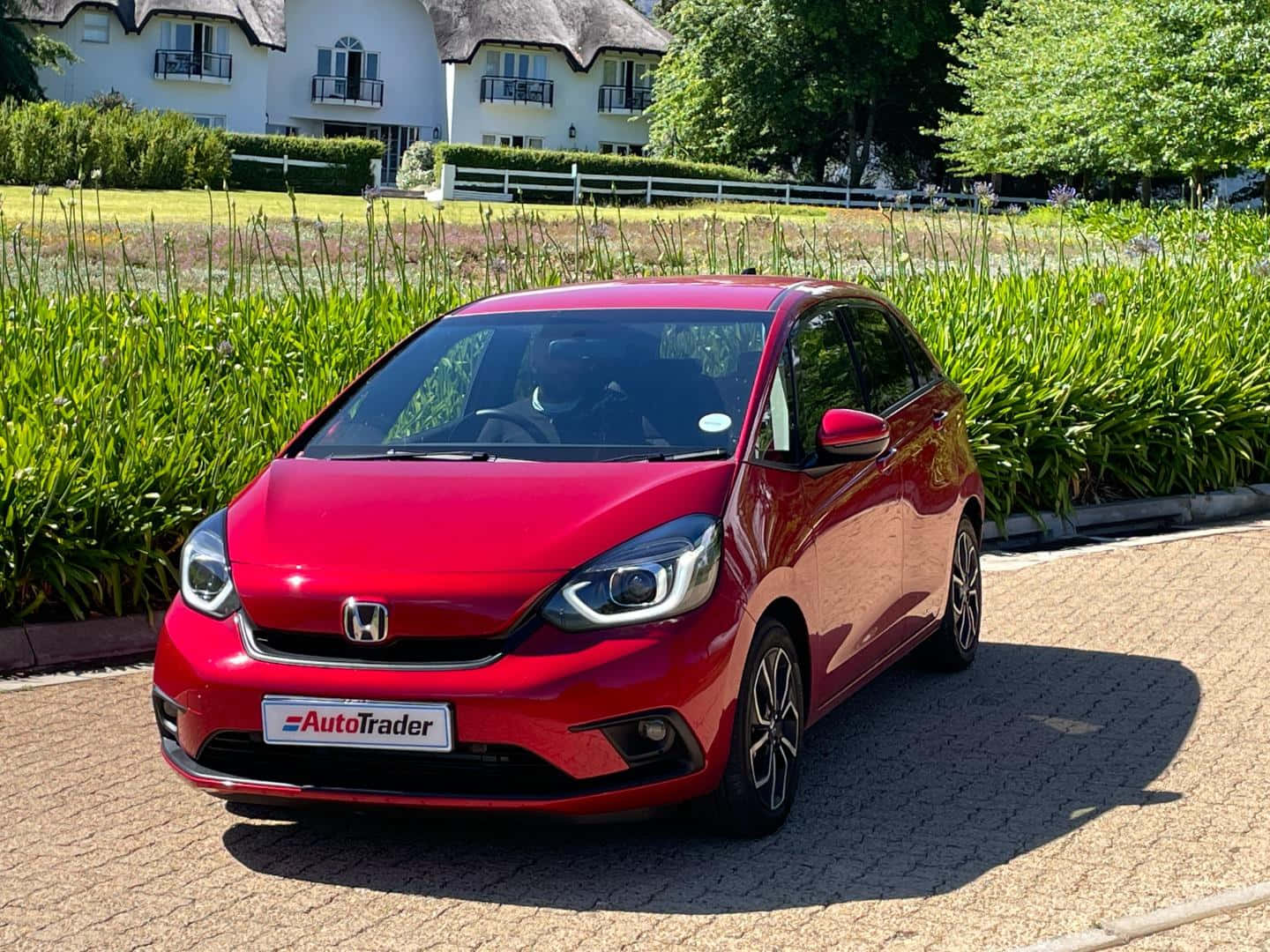 Sleek And Modern Honda Fit On The Open Road Wallpaper