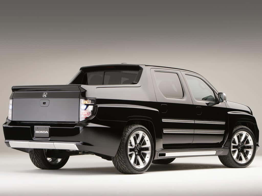 Sleek And Modern Honda Ridgeline On The Road Wallpaper