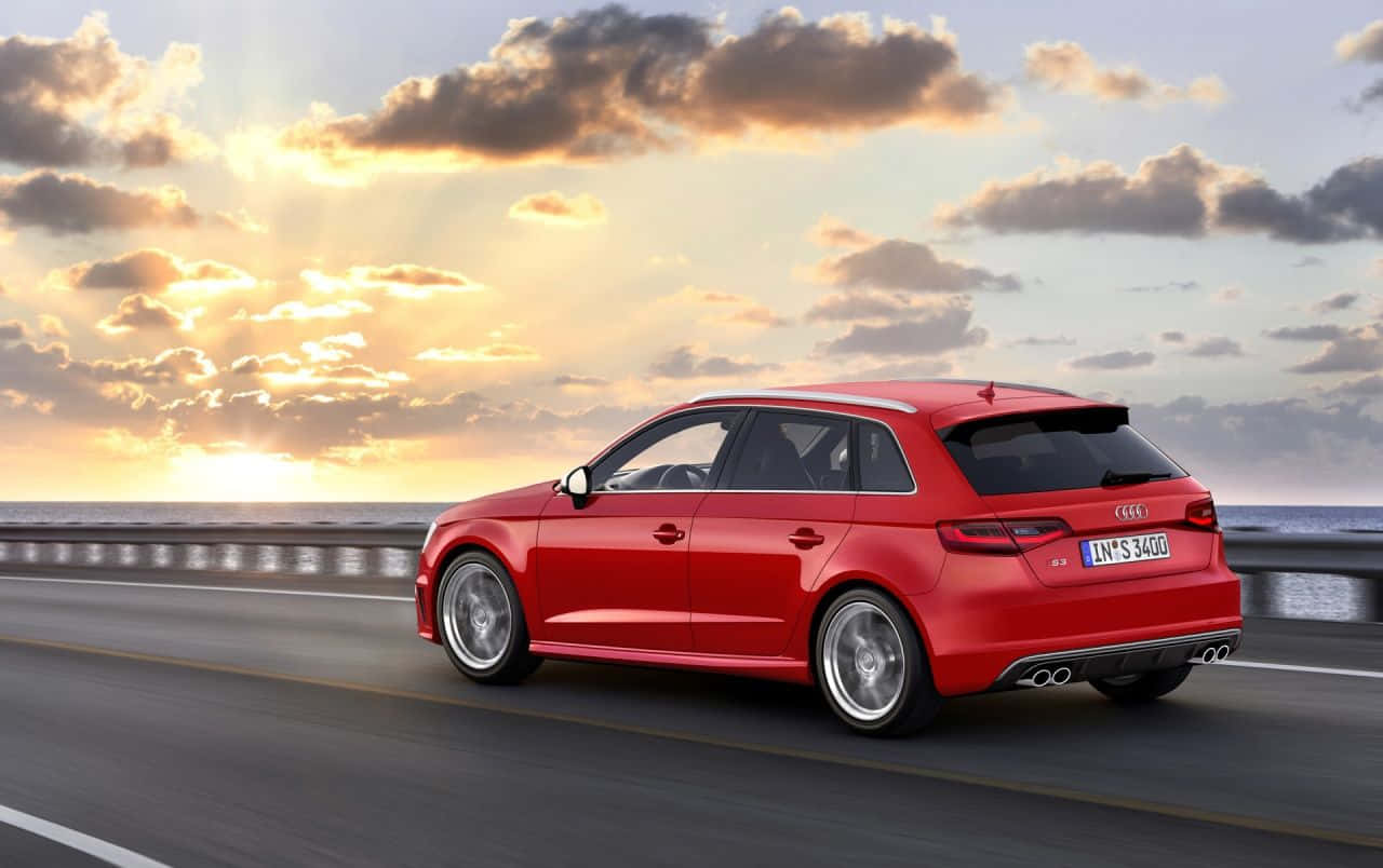 Sleek And Powerful Audi S3 On The Road Wallpaper