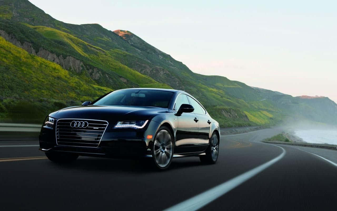 Sleek And Powerful Audi S7 In Motion Wallpaper