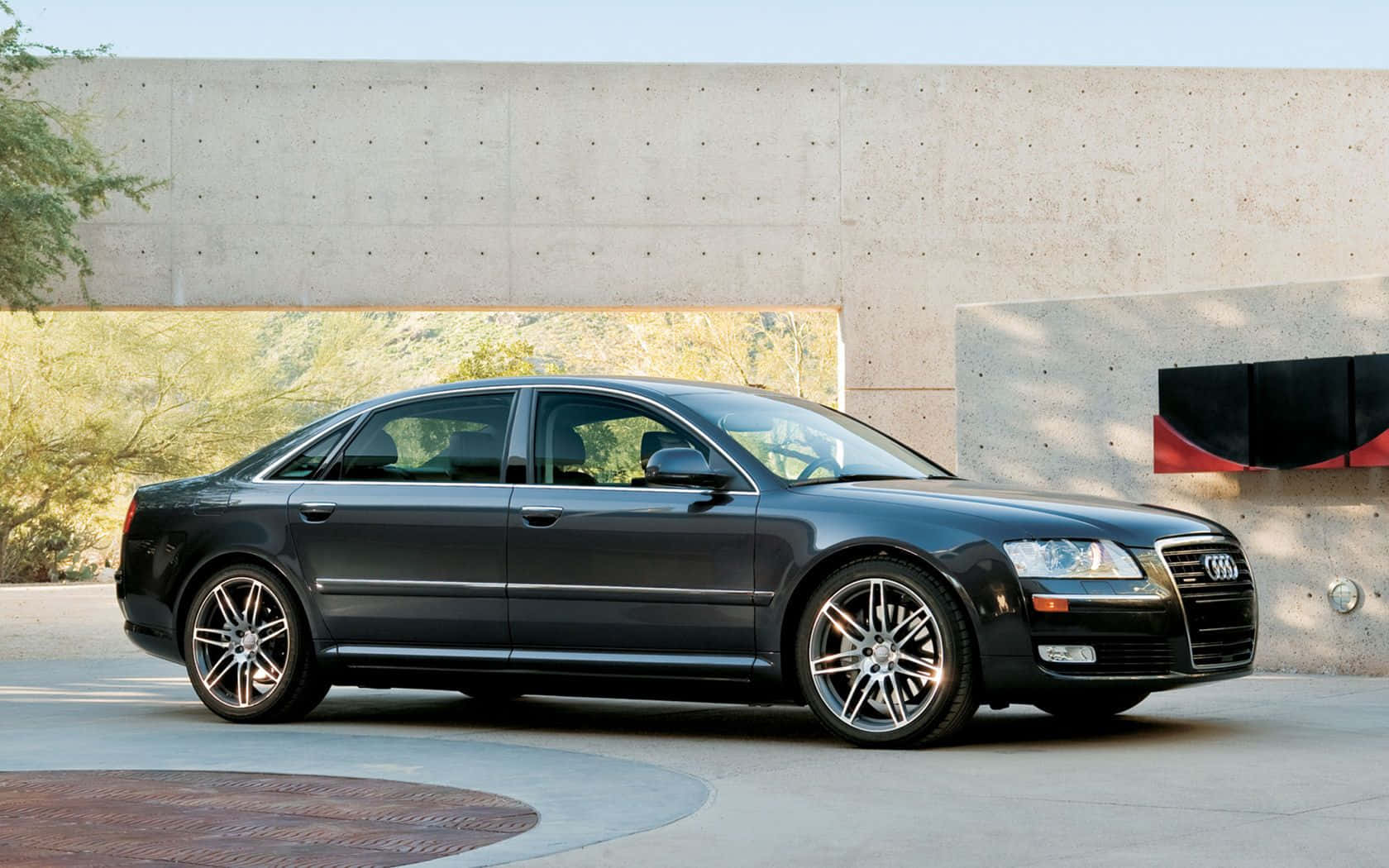 Sleek And Powerful Audi S8 On The Open Road Wallpaper