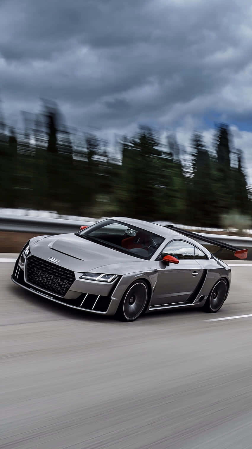 Sleek And Powerful Audi Tt Rs On The Road Wallpaper