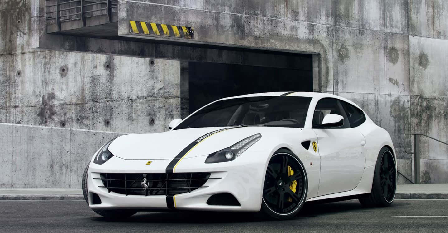 Sleek And Powerful Ferrari Ff On An Open Road Wallpaper