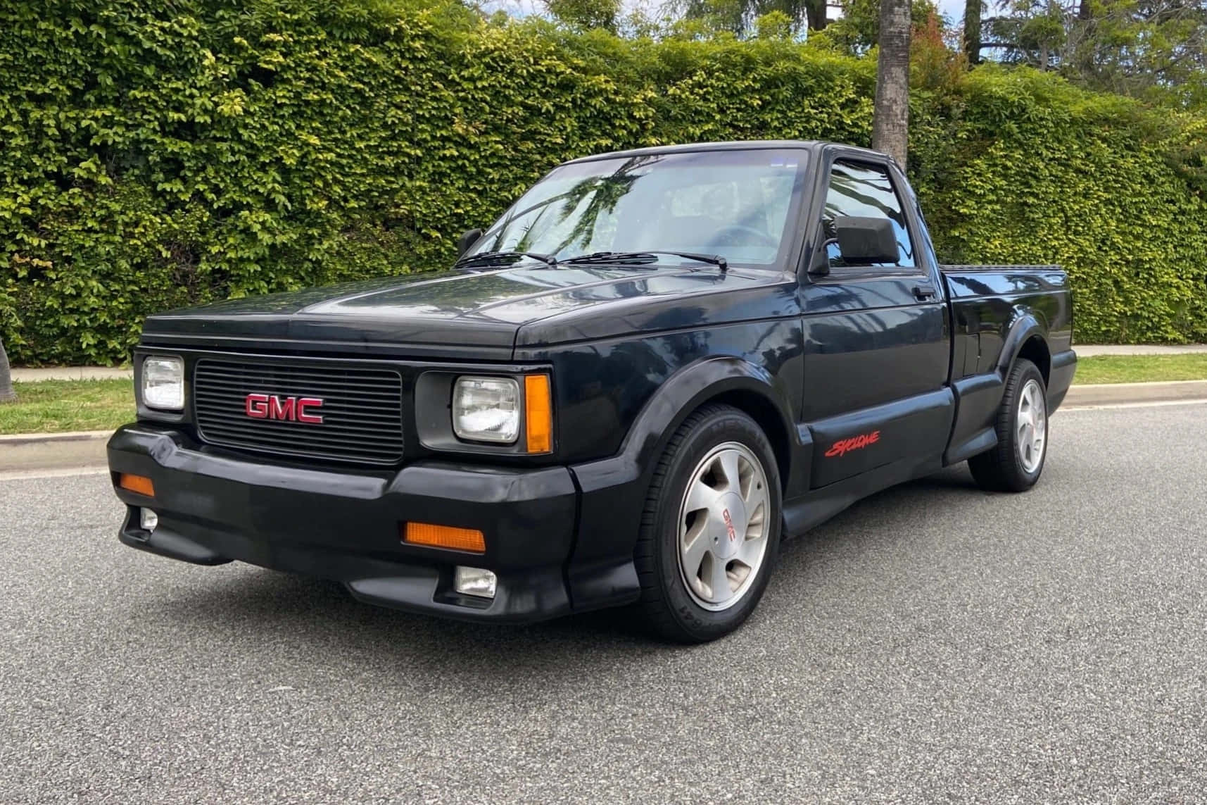 Sleek And Powerful Gmc Syclone In Its Prime Wallpaper