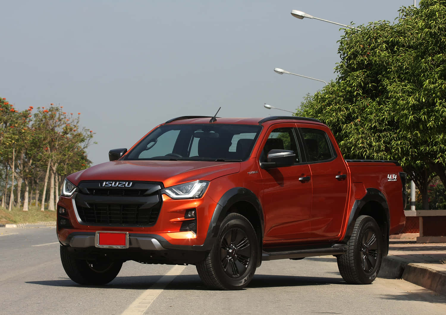 Sleek And Powerful Isuzu Truck On A Scenic Mountain Road Wallpaper