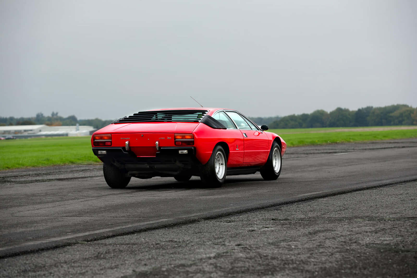 Sleek And Powerful Lamborghini Urraco In Action Wallpaper