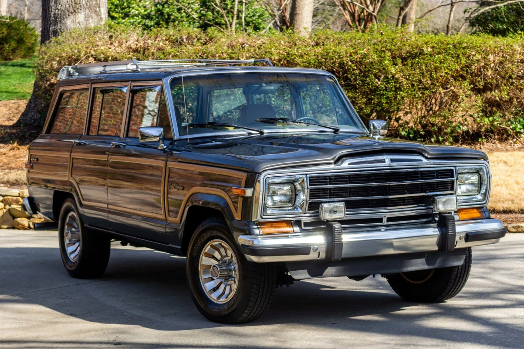 Sleek And Rugged Jeep Wagoneer On A Scenic Mountain Adventure Wallpaper