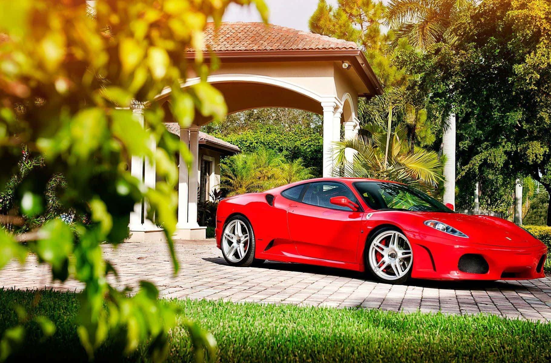 Sleek And Smooth Red Ferrari F430 On Display Wallpaper