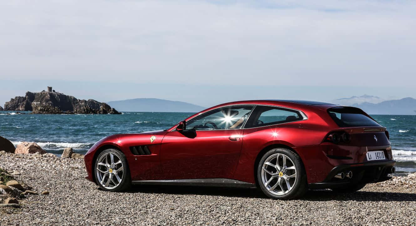 Sleek And Stunning Ferrari Gtc4lusso In Motion Wallpaper