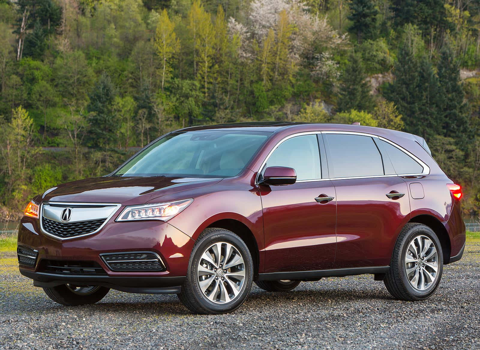 Sleek And Stylish Acura Mdx On The Road Wallpaper