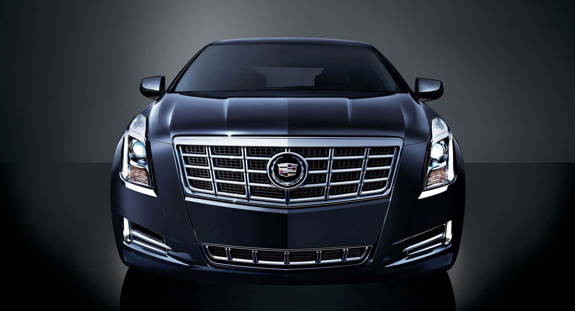 Sleek And Stylish Cadillac Xts In Motion Wallpaper