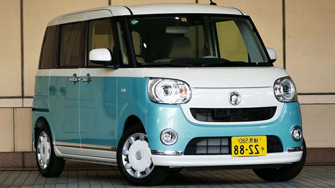 Sleek And Stylish Daihatsu Car On Open Road Wallpaper