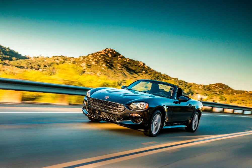 Sleek And Stylish Fiat 124 Spider Wallpaper