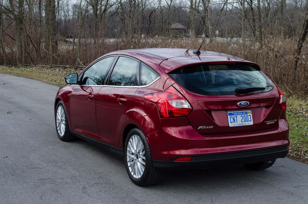 Sleek And Stylish Ford Focus On Scenic Open Road Wallpaper