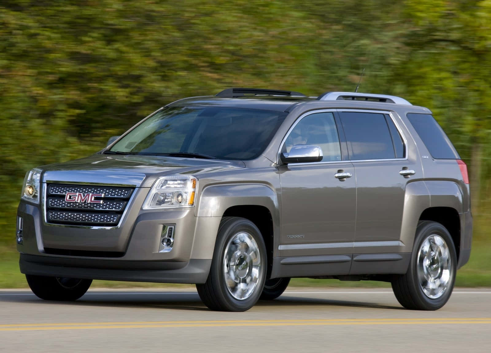 Sleek And Stylish Gmc Terrain On The Road Wallpaper