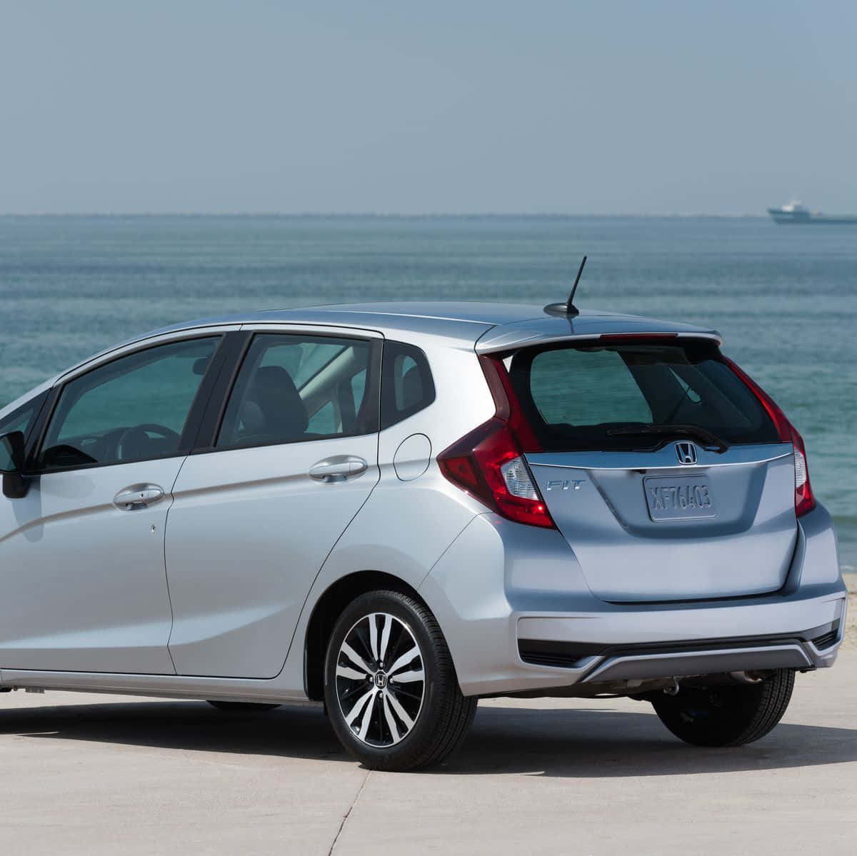 Sleek And Stylish Honda Fit In Action Wallpaper