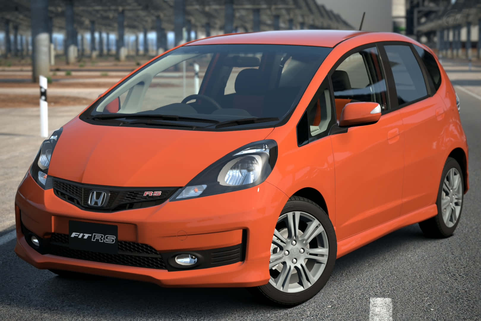 Sleek And Stylish Honda Fit On The Road Wallpaper