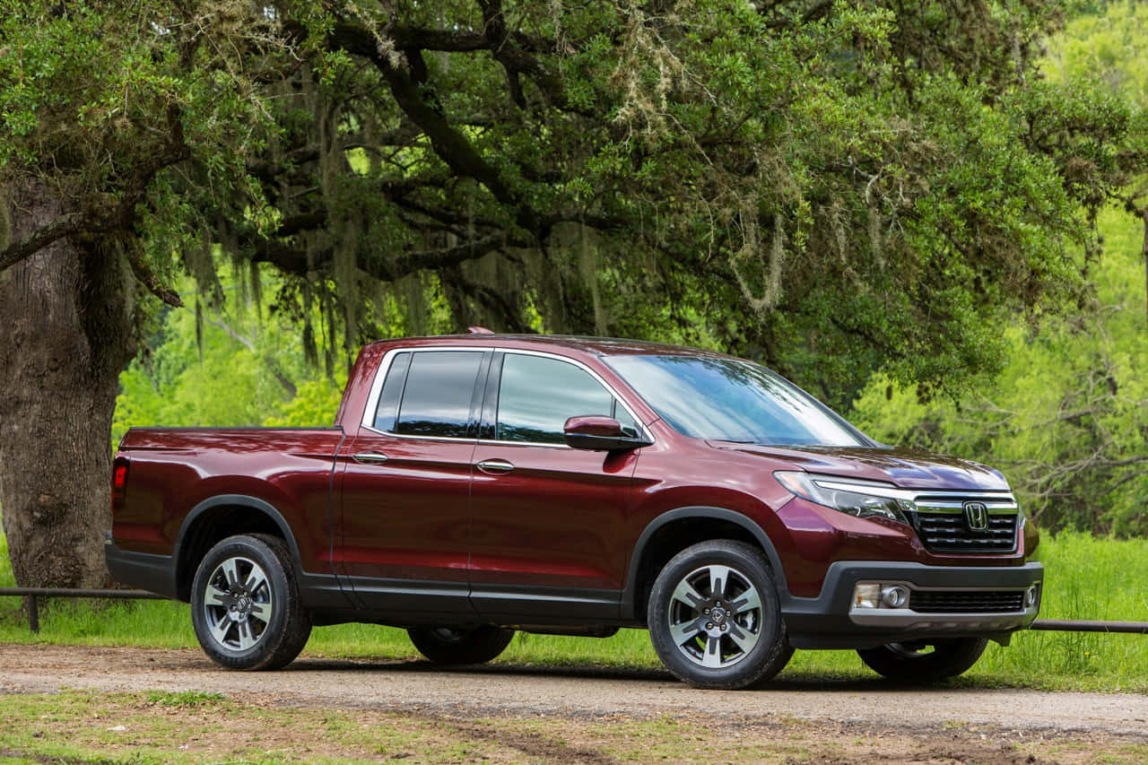 Sleek And Stylish Honda Ridgeline On The Road Wallpaper