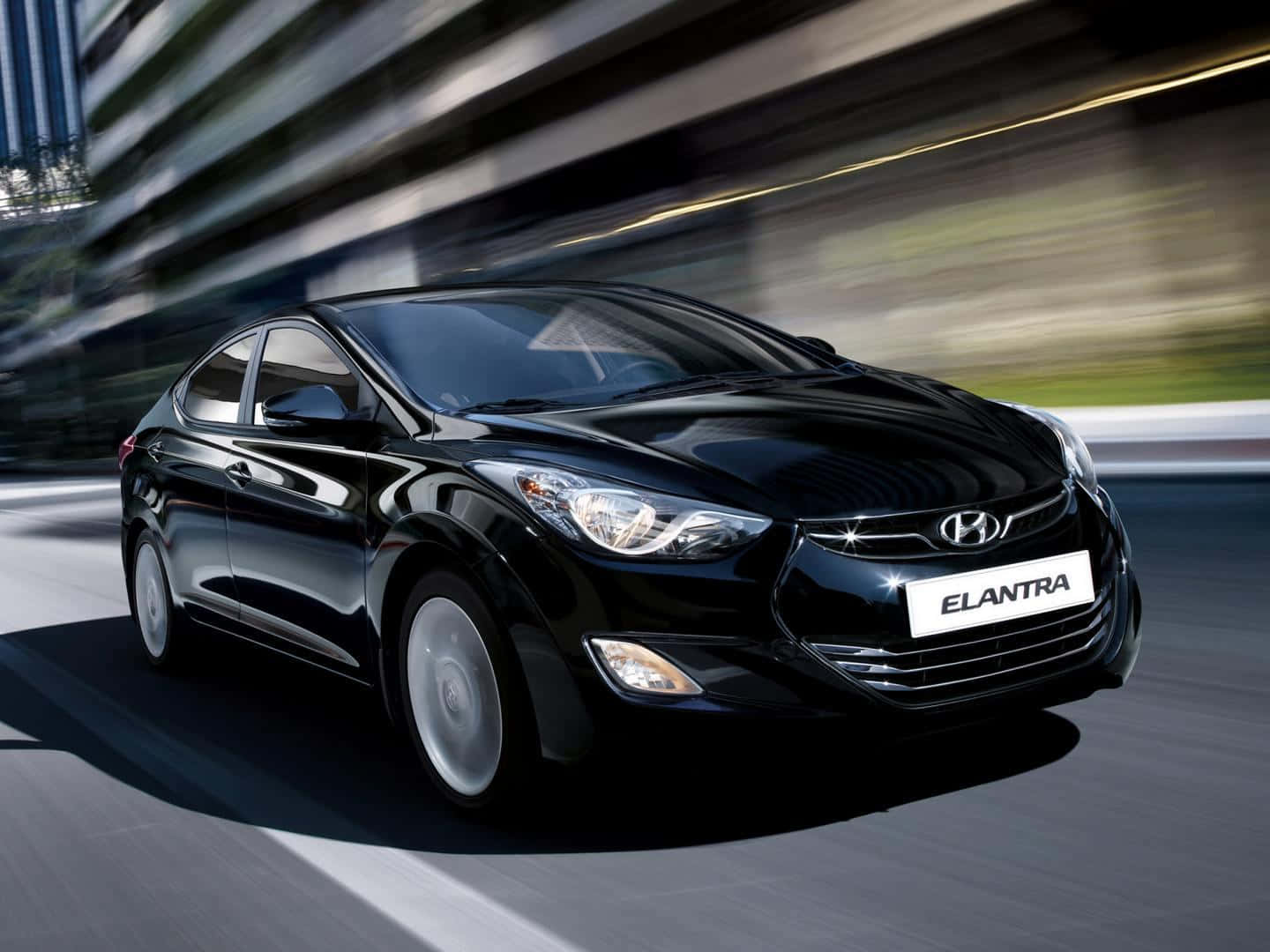 Sleek And Stylish Hyundai Elantra In Motion Wallpaper